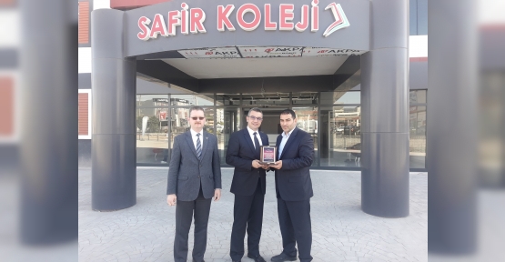 CANER GÖÇMEZ'DEN HİZMETE PLAKET